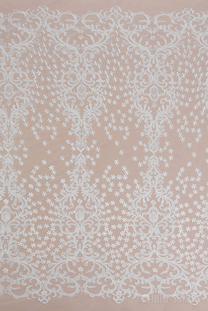 纹理蕾丝面料白底花边工作室纱或线制成的薄织物象牙色蕾丝布的背景