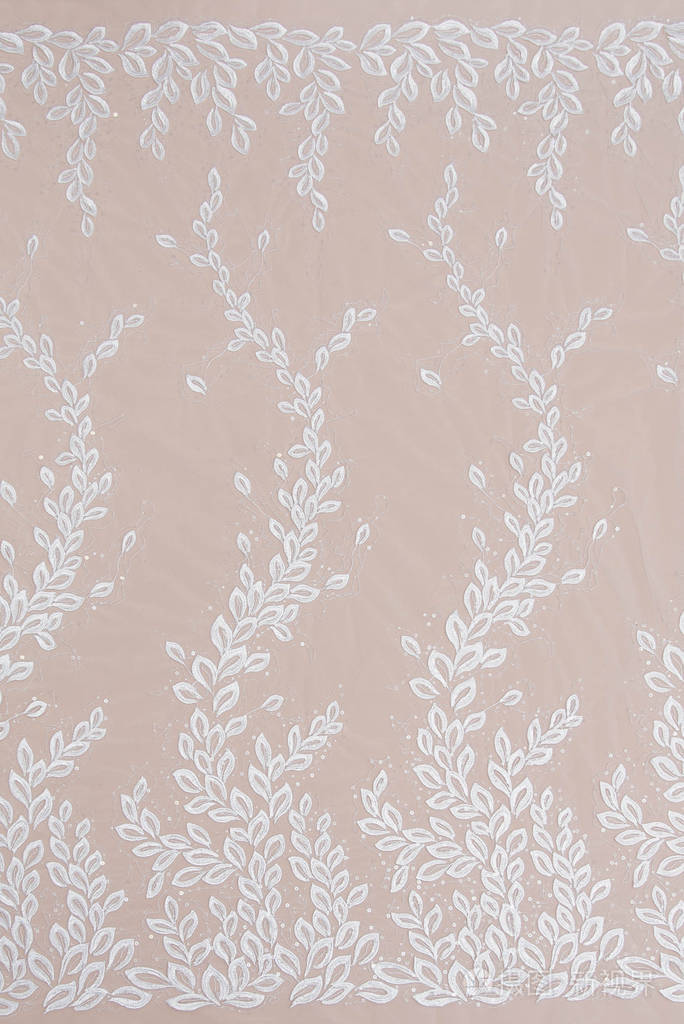 纹理蕾丝面料白底花边工作室纱或线制成的薄织物象牙色蕾丝布的背景