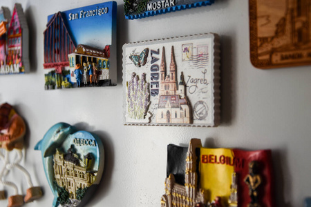 Many magnets on the refrigerator from the countries of the world