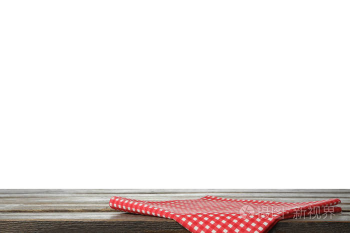 折叠的厨房毛巾放在木桌上。设计空间