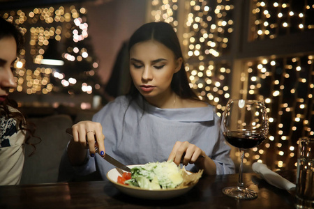 The girl in the evening rest in a cafe 