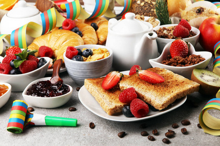 Breakfast served with coffee, orange juice, croissants, cereals 