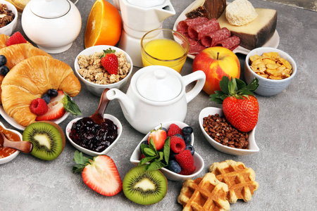 Breakfast served with coffee, orange juice, croissants, cereals 