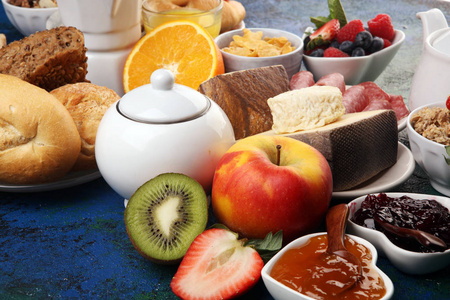 Breakfast served with coffee, orange juice, croissants, cereals 