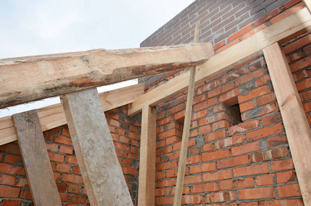  House roof wooden frame construction with trusses, wooden beams