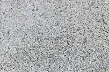 灰色纹理水泥墙背景与细混凝土碎片.建设背景照片