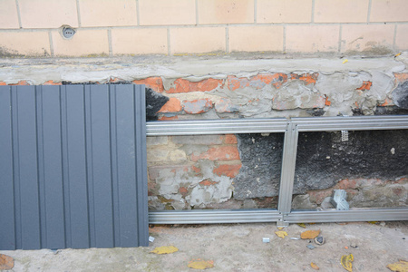 House foundation wall repair,  fix with installing metal sheets 