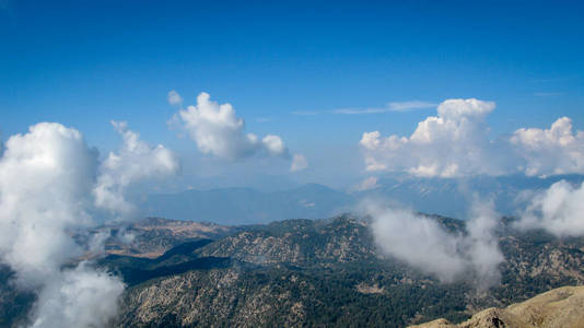 view from the top of the mountain to the mountains covered with 