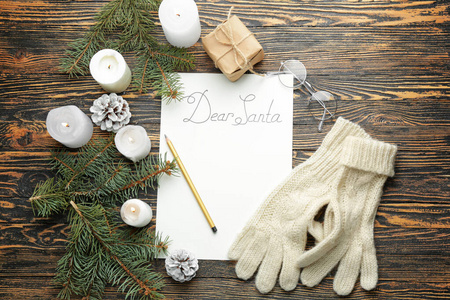 Empty letter to Santa Claus on wooden background