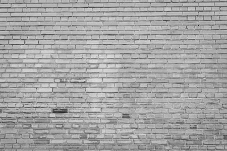 Background of old black and white stone wall. Texture of brick. 