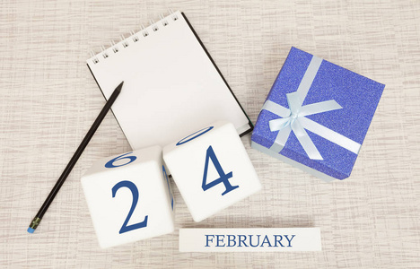 日历上有流行的蓝色文字和2月24日的数字，还有一个盒子里的礼物。