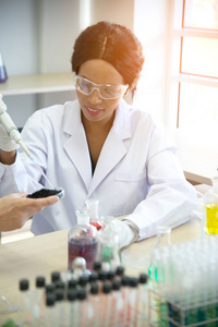 scientist with equipment and science experiments, laboratory gla