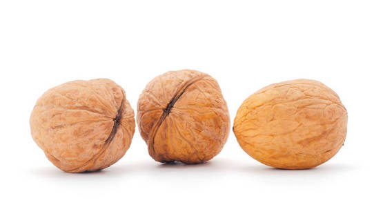 Three walnuts isolated on a white. 