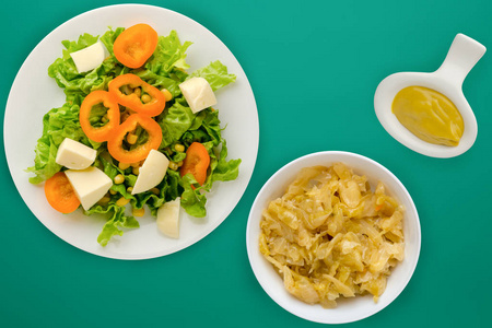  salad of cheese, lettuce, corn, pepper on a colored  background