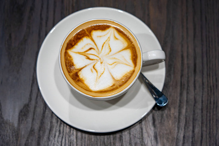 Top view photo of cappuccino coffee with beautiful latte art 