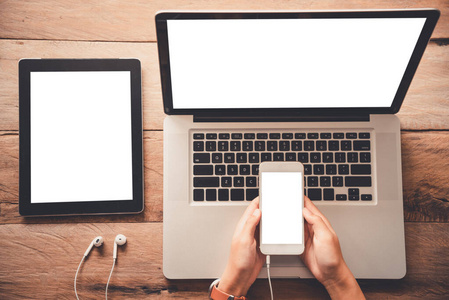  topview businessmen use smartphones and laptop to connect and f