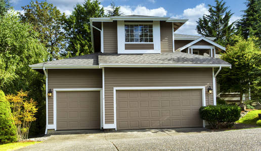 Exterior of residential home freshly painted during summer time 