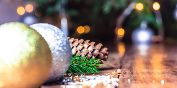 Rustic wood table in front of christmas tree. Christmas lights. 