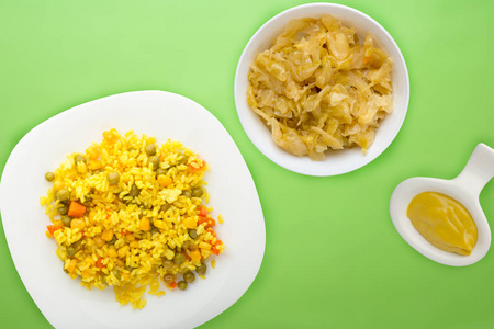  Asian healthy food. yellow rice on a white plate with vegetable