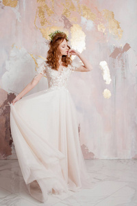 Elegant redhaired girl bride. Young beautiful woman in wedding 