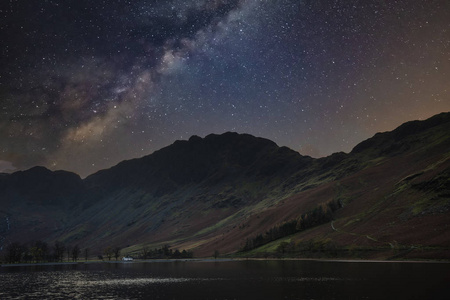 Stunning majestic digital composite landscape of Milky Way over 