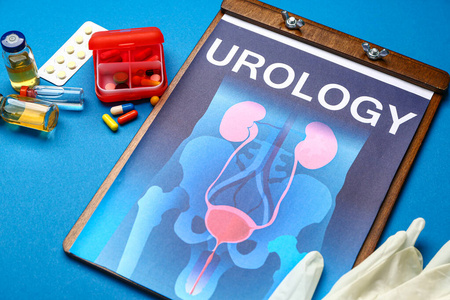 彩色背景上有泌尿生殖系统药品和手套图片的纸张