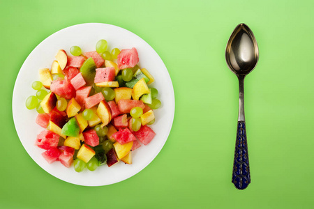  healthy food. fresh fruit salad on a white  plate. vegan food o