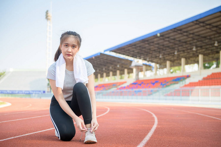 Athlete girl trying running shoes getting ready for jogging 