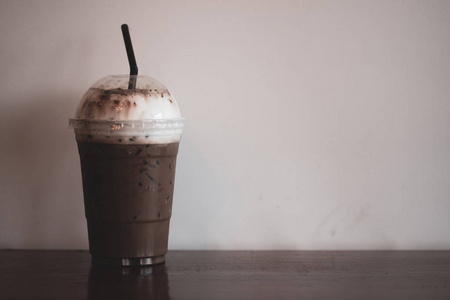 Mocha iced coffee on a cup in coffee shop 