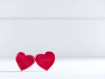 two authentic red wooden hearts 
