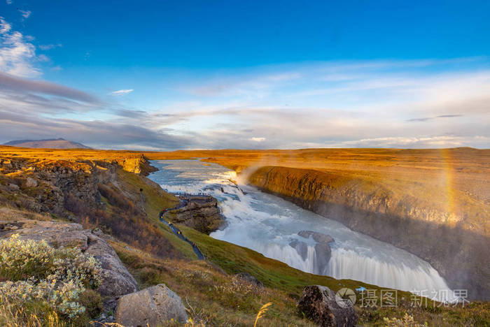 Gullfoss waterfall seen from afar with unrecognisable visitors, 