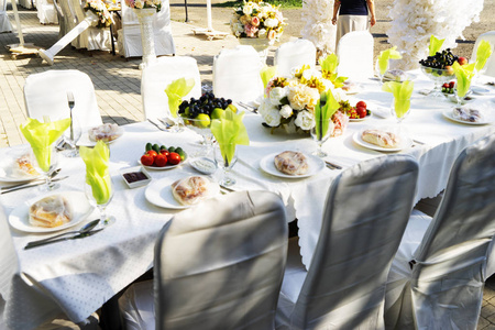 Elegant banquet tables prepared for a conference or a party and 
