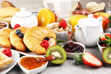 Breakfast served with coffee, orange juice, croissants, cereals 