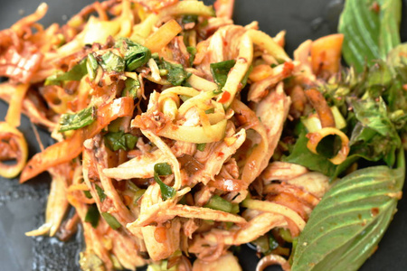  spicy chicken meat with banana blossom and mango Thai salad on 