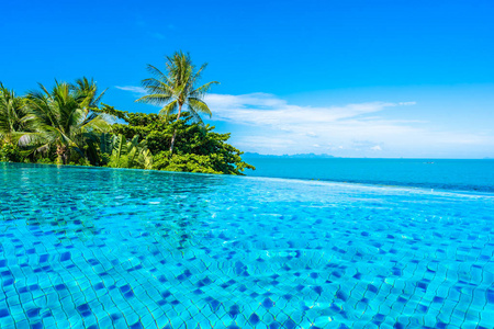 Beautiful luxury outdoor swimming pool in hotel resort with sea 