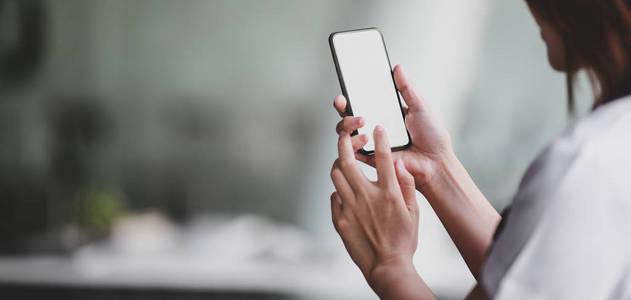 Closeup view of professional doctor using blank screen smartpho