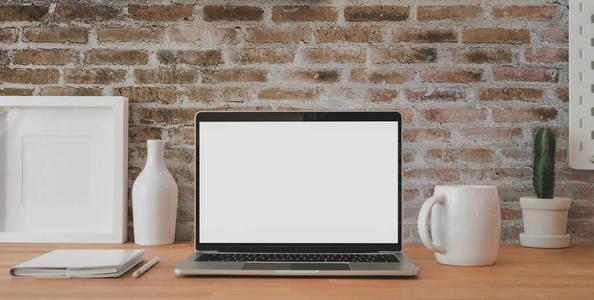 Cropped shot of vintage workplace with mockup laptop computer a