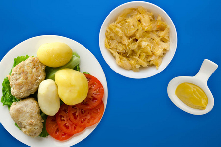  cutlet with potatoes on a white  plate. cutlet with potatoes on