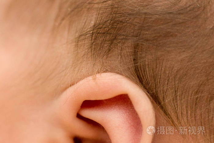 ear and hair of the newborn baby, macro, close up, maternal care