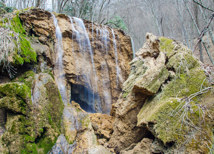 rocks and waterfall in forest 