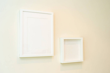 Empty photo frame on wall decoration interior