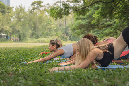 four diverse woman friends having fun workout and yoga together 