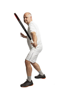 Bald aged man in a sports uniform with a tennis racket in his ha