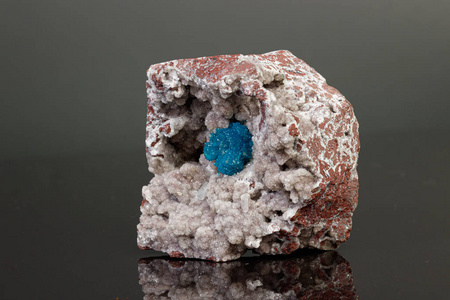 Macro mineral stone Cavansite on a gray background 