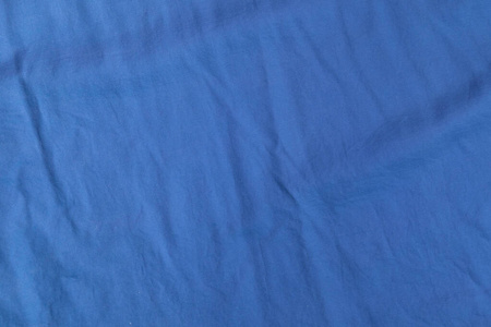 蓝色皱纹布衬衫的背景纹理图片