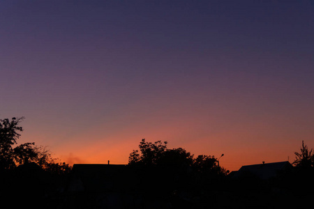 Evening sunset in the village a far away from the city. The sky 