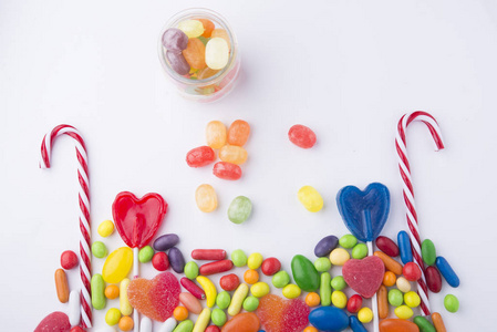 Multicolor candies in glass jars 