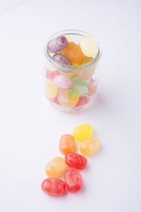 Multicolor candies in glass jars 