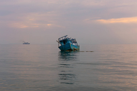 An old shipwreck or abandoned shipwreck.,Wrecked boat abandoned 