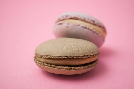 Closeup of french macarons on pink background 